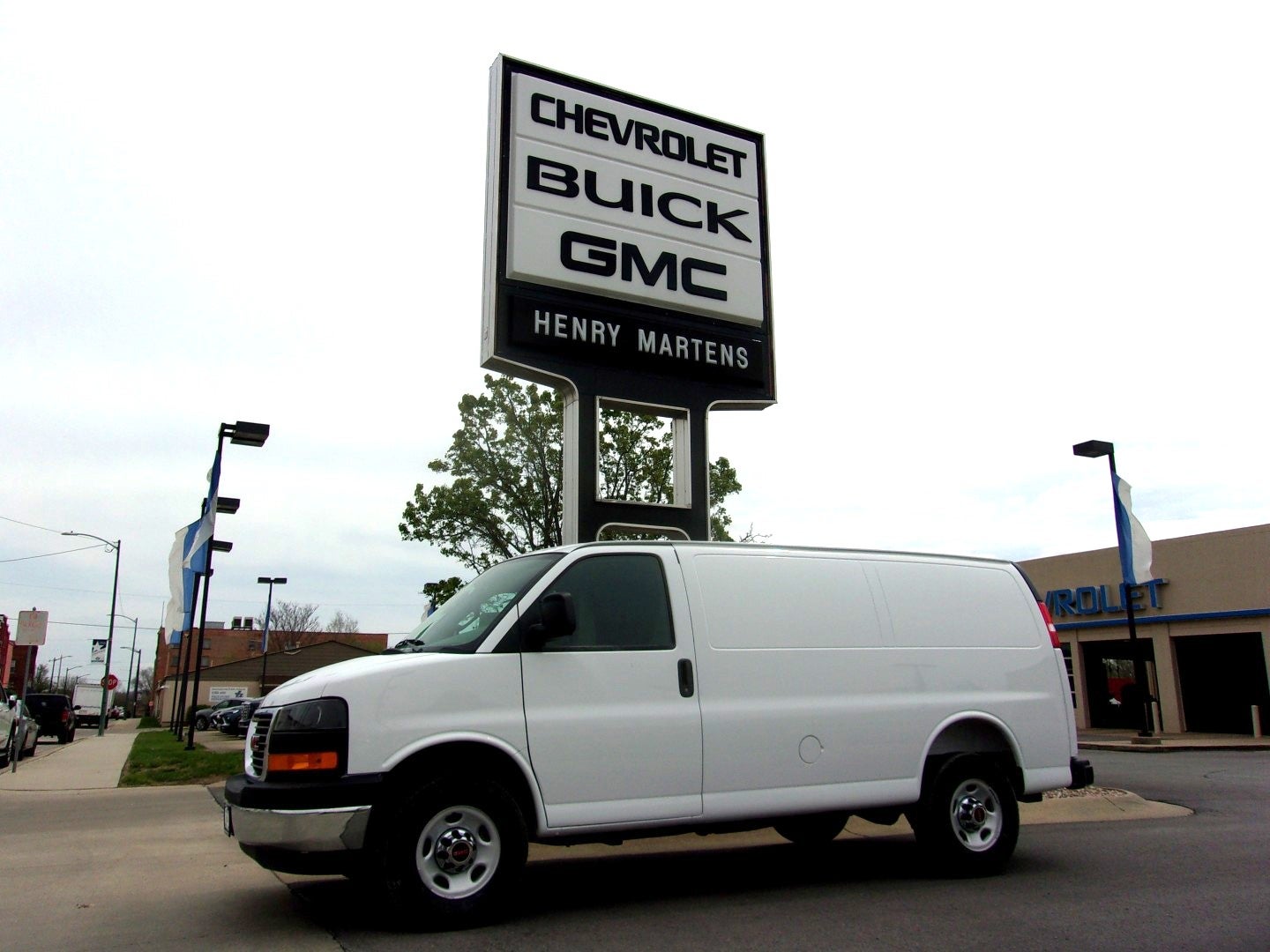 2026 GMC Savana Cargo Work Van in Summit White — front three-quarter view
