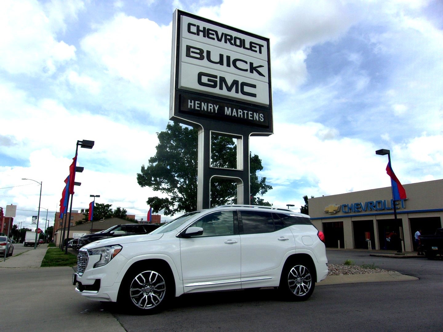 2022 GMC Terrain Denali in Summit White — front three-quarter view