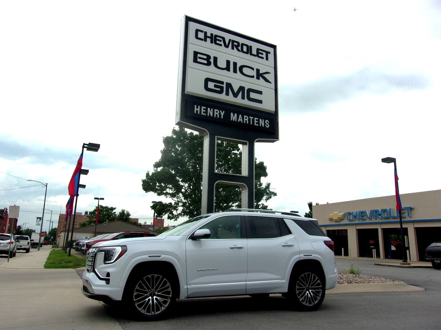 2026 GMC Terrain Denali in Glacier White Tricoat — front three-quarter view