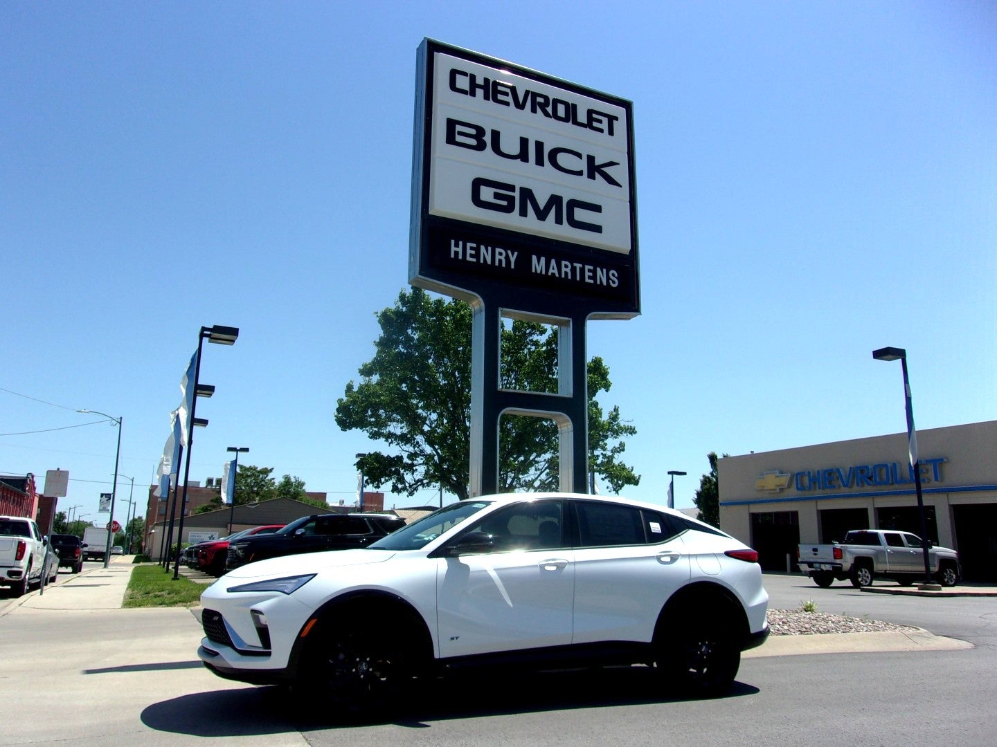 2026 Buick Envista Sport Touring in Summit White — front three-quarter view