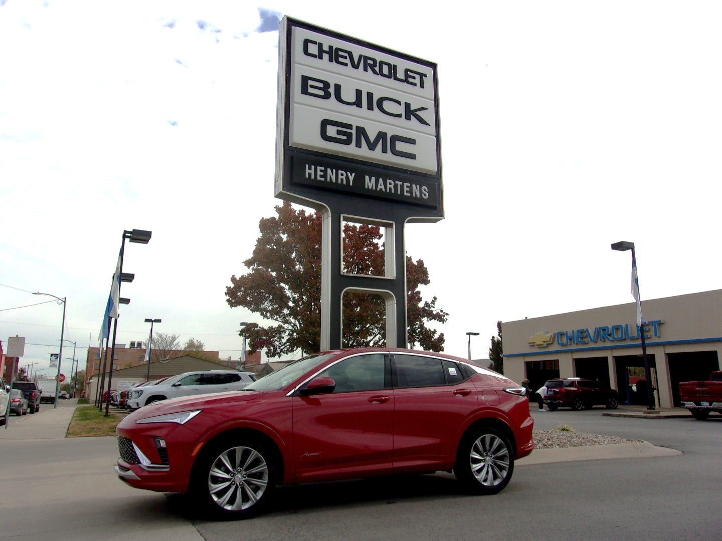 2026 Buick Envista Avenir in Brilliant Red — front three-quarter view