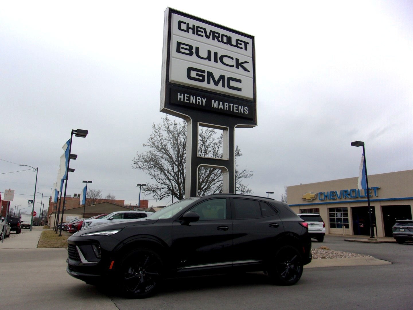 2026 Buick Envision Sport Touring in Ebony Twilight Metallic — front three-quarter view
