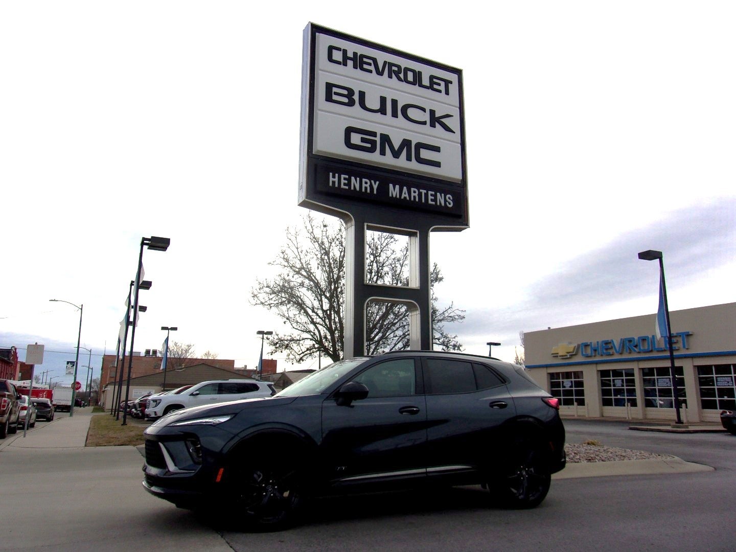 2026 Buick Envision Sport Touring in Quartz Blue Metallic — front three-quarter view