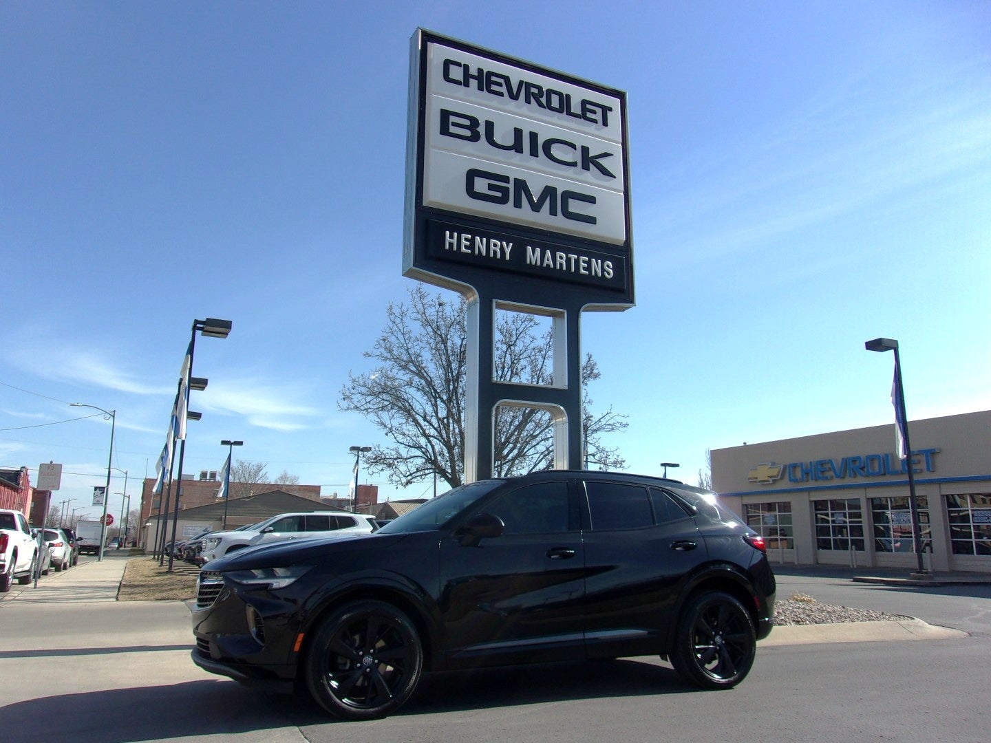 2022 Buick Envision Essence in Ebony Twilight Metallic — front three-quarter view