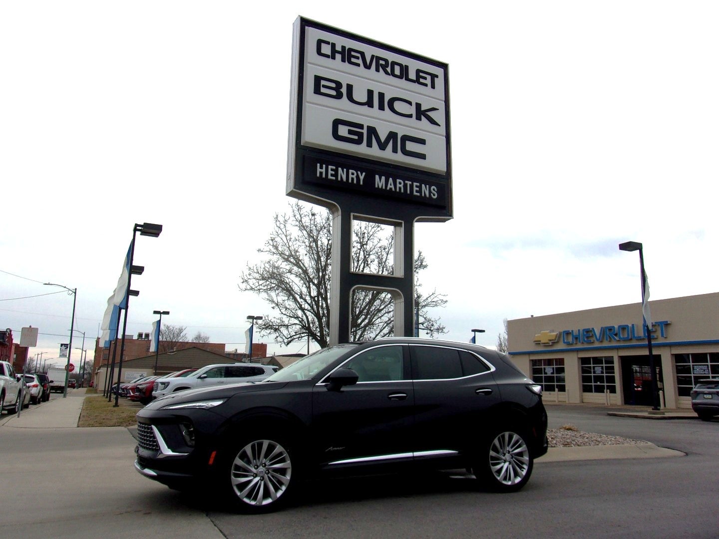 2026 Buick Envision Avenir in Ebony Twilight Metallic — front three-quarter view
