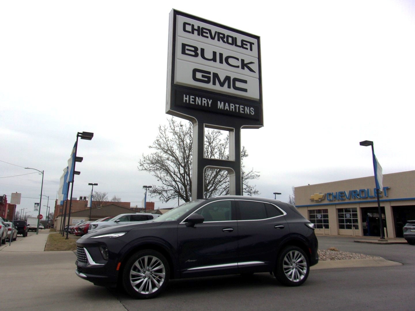 2026 Buick Envision Avenir in Midnight Opal — front three-quarter view